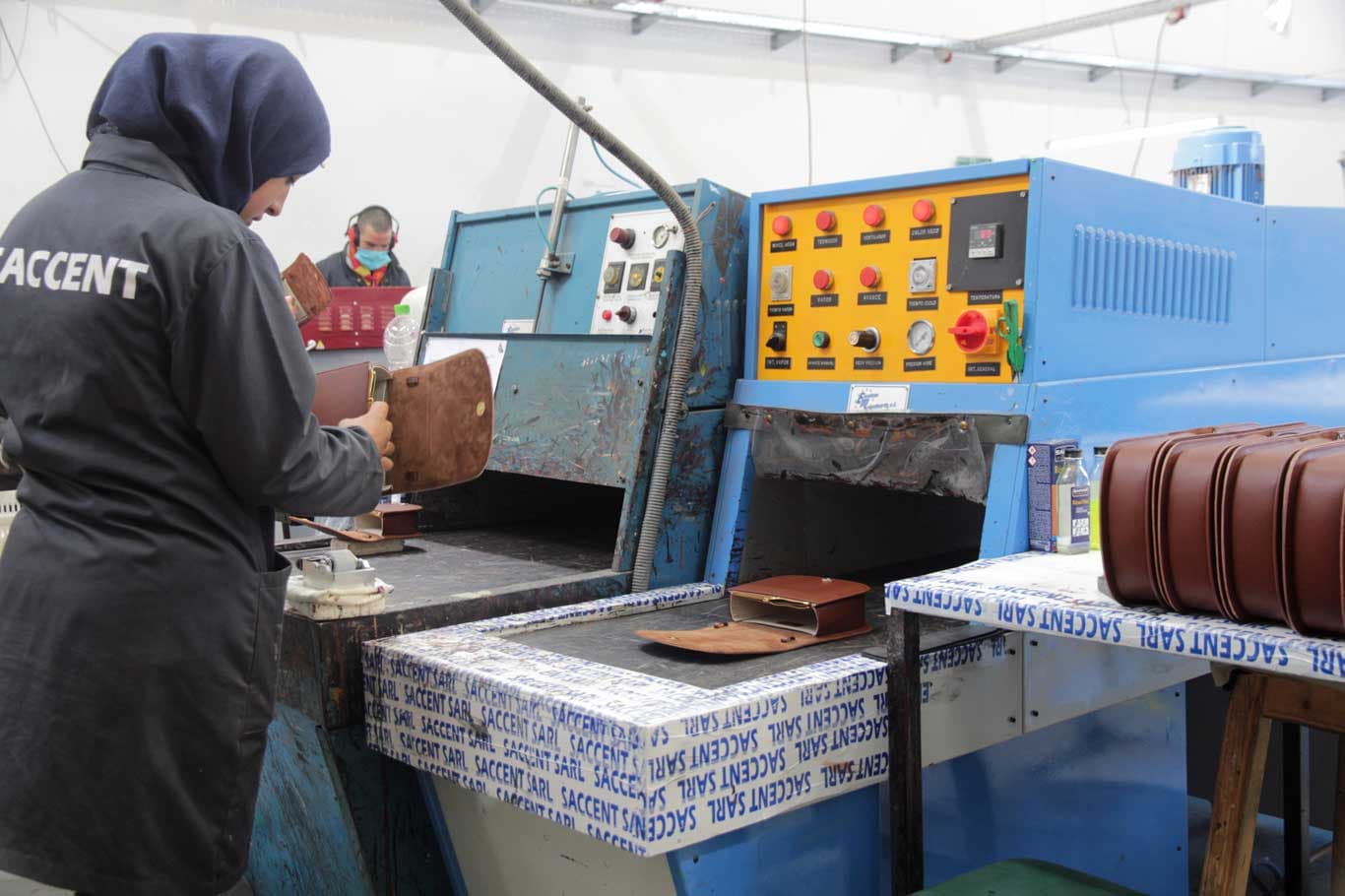 Leather flap heat-formed on a moulding machine at Saccent in Fes, Morocco