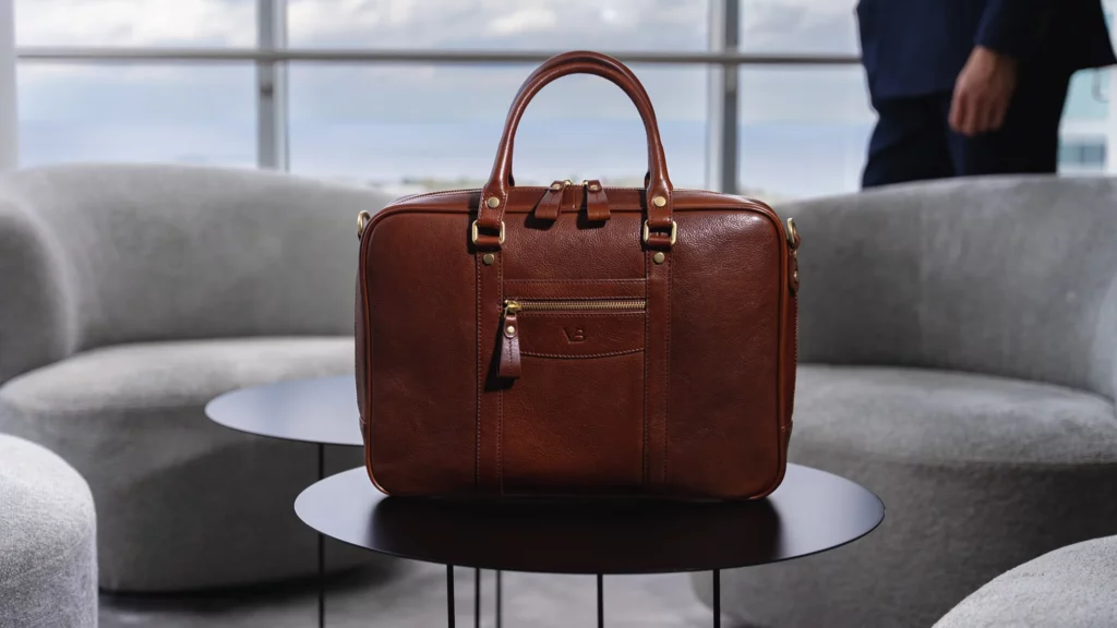 Von baer city business leather laptop bag brown on the table in the president suite slider